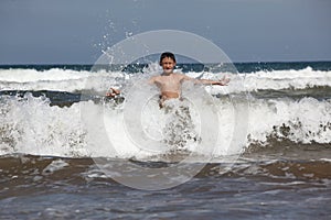 Boy with ocean waves