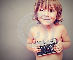 Boy with an old camera