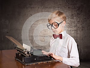 Boy with the old typewriter