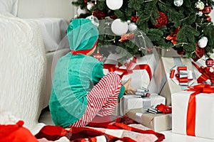 Happy excited child holding christmas gift box