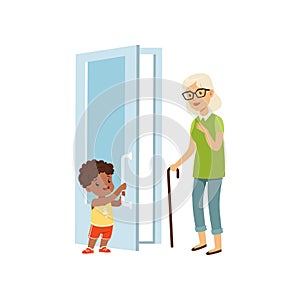 Boy opening the door to an elderly woman, kids good manners concept vector Illustration on a white background photo