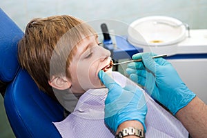 Boy opening his mouth wide during inspection