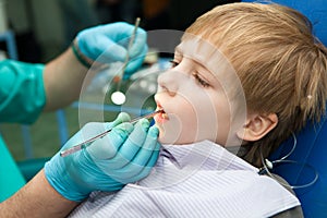 Boy opening his mouth wide during inspection