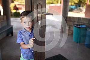 Boy opening mirrored front door