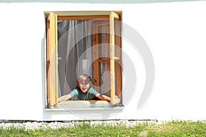 Boy opening the window