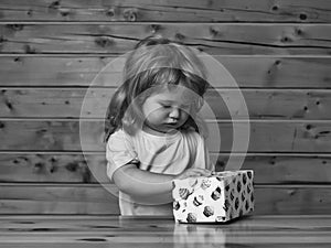 Boy opens box with cakes