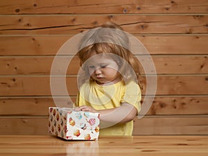 Boy opens box with cakes