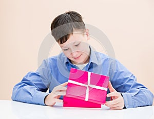 The boy opens a box of surprise