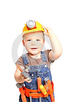 Boy in the orange helmet with tools on a white background