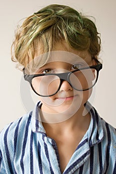Boy in oversize glasses