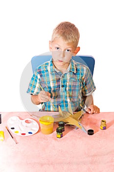 Boy paint airplane model