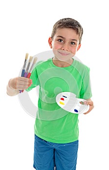 Boy with paintbrushes and artist palette