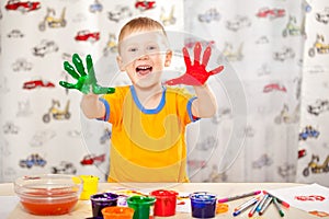 Boy with painted fingers