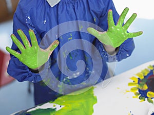 Boy With Painted Hands In Art Class