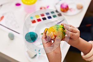 Boy Painting Easter Egg Close Up