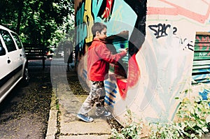 Boy painting graffiti