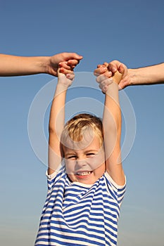 Boy with parents hands