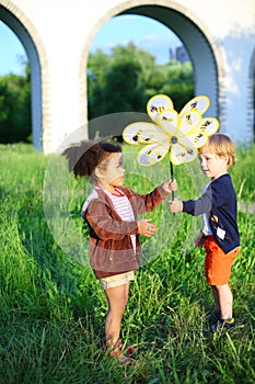 The boy passes wind spinner to the