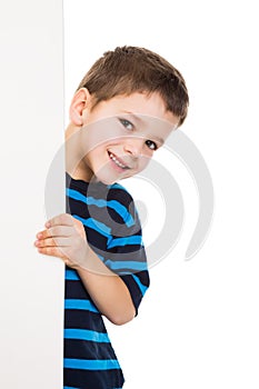 Boy peek out from vertical white banner