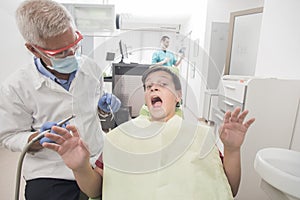 Boy with perfect teeth scared of the dentist