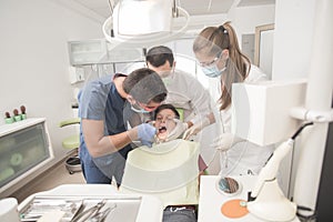 Boy with perfect teeth scared at the dentist