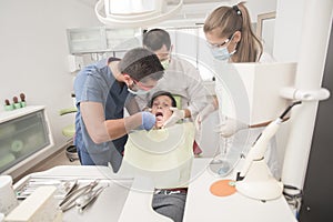 Boy with perfect teeth scared at the dentist