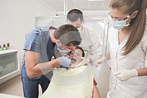 Boy with perfect teeth scared at the dentist