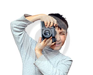 Boy photographing vertical with black slr camera
