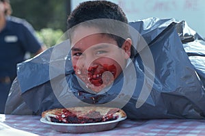 Boy at pie eating contest