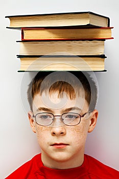 Boy with a pile of books