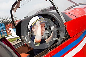 Boy pilot a real airplane steering wheel, instruments,