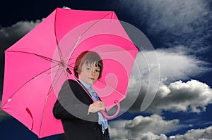 Boy with pink umbrella