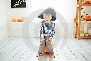 Boy in a pirate costume celebrates Halloween at home.