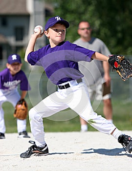 Boy pitching baseball