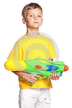 Boy with plastic water gun