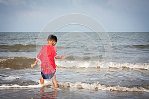 boy play at the beach