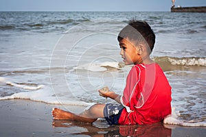 Boy play at the beach