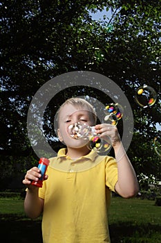 Boy play in bubbles