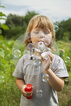 Boy play in bubbles