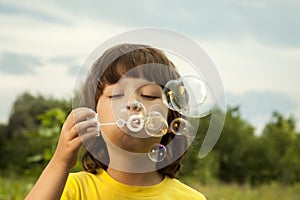 Boy play in bubbles