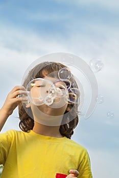 Boy play in bubbles