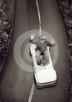 Boy in play car