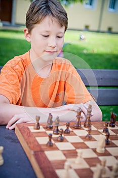 Boy play Chess with Concentration