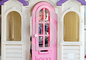 A boy play in a doll house