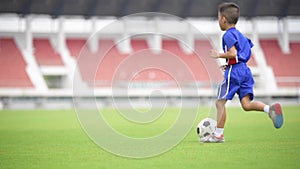 Boy play football in the ground