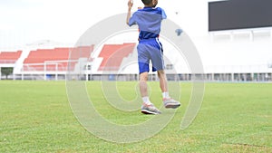 Boy play football in the ground