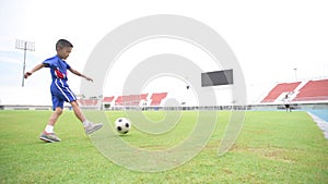 Boy play football in the ground