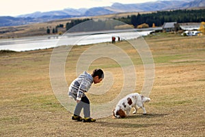 Boy play with Puppy