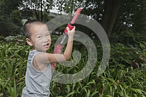 Boy play water gun