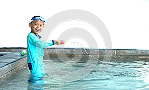 Boy play water gun in action Line of water expose with smile in swimming pool